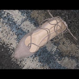 Nude and black ballerina sandals